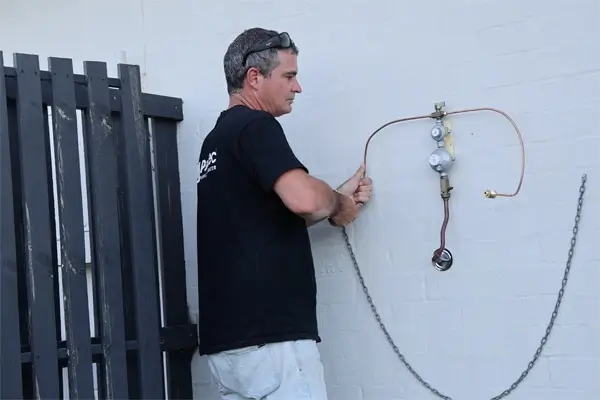 Qualified gas fitter in Logan installing safe gas lines for hot water systems, heaters and BBQs